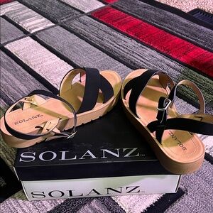 Solanz Women's Black and Tan Sandals